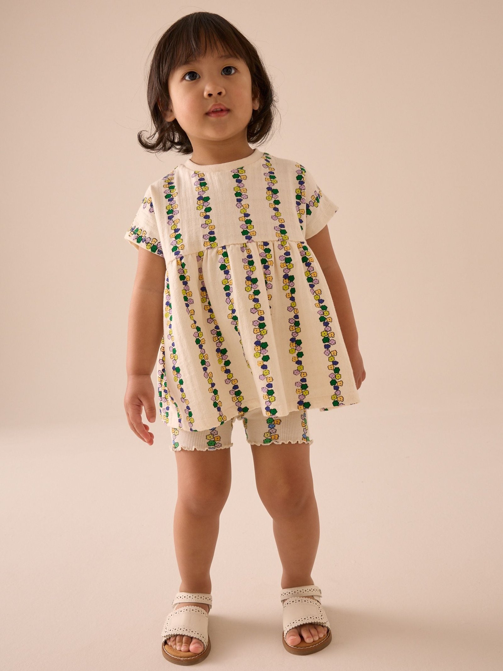 Cream Flowers Short Sleeve Peplum Top and Cycle Shorts Set (3mths-7yrs)